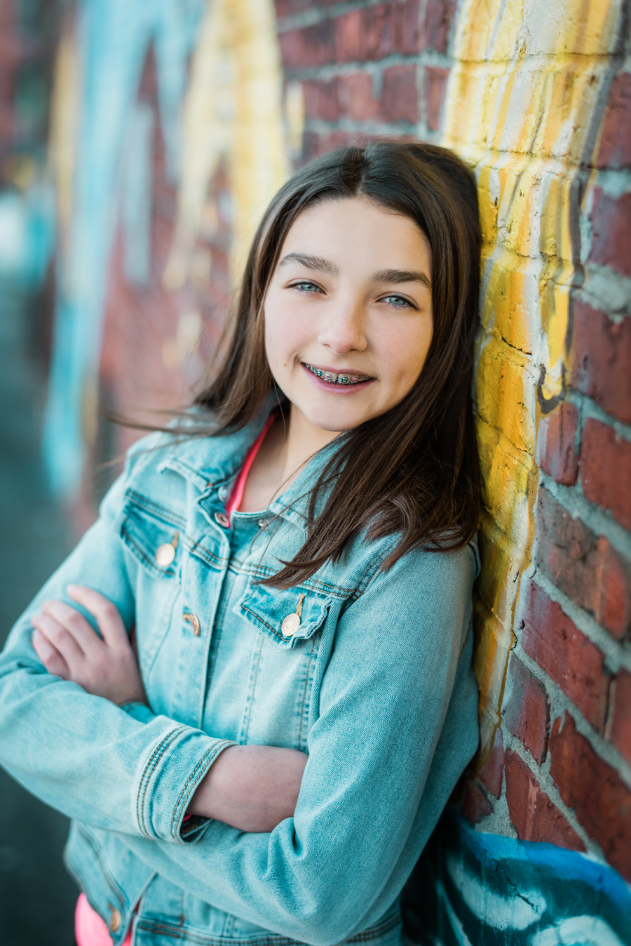 portrait kid on brick wall lawerence